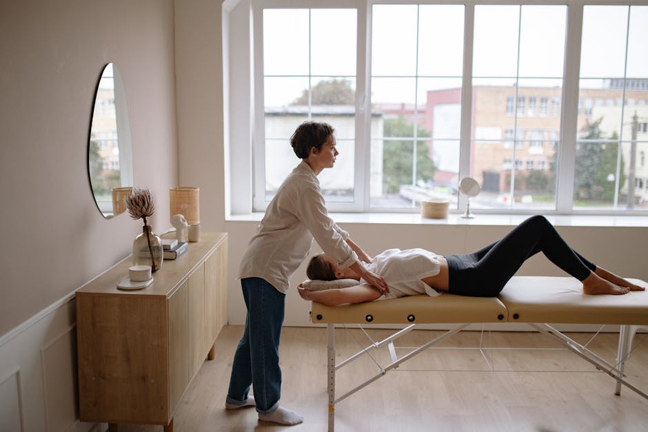 Massage therapist treating a client in a calming indoor space. Perfect for wellness and relaxation themes.